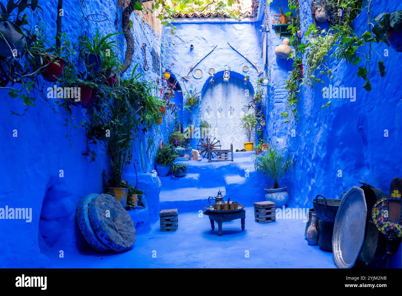 A small blue colored courtyard in a house in Chefchaouen, Morocco. Stock Photo
