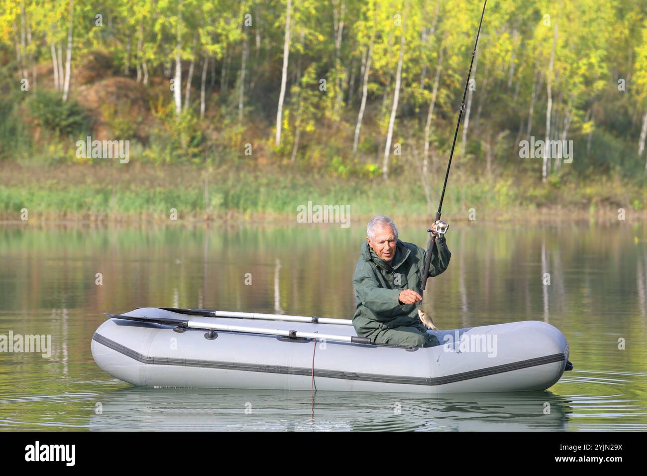 Elderly man fishing rod from hi-res stock photography and images - Alamy