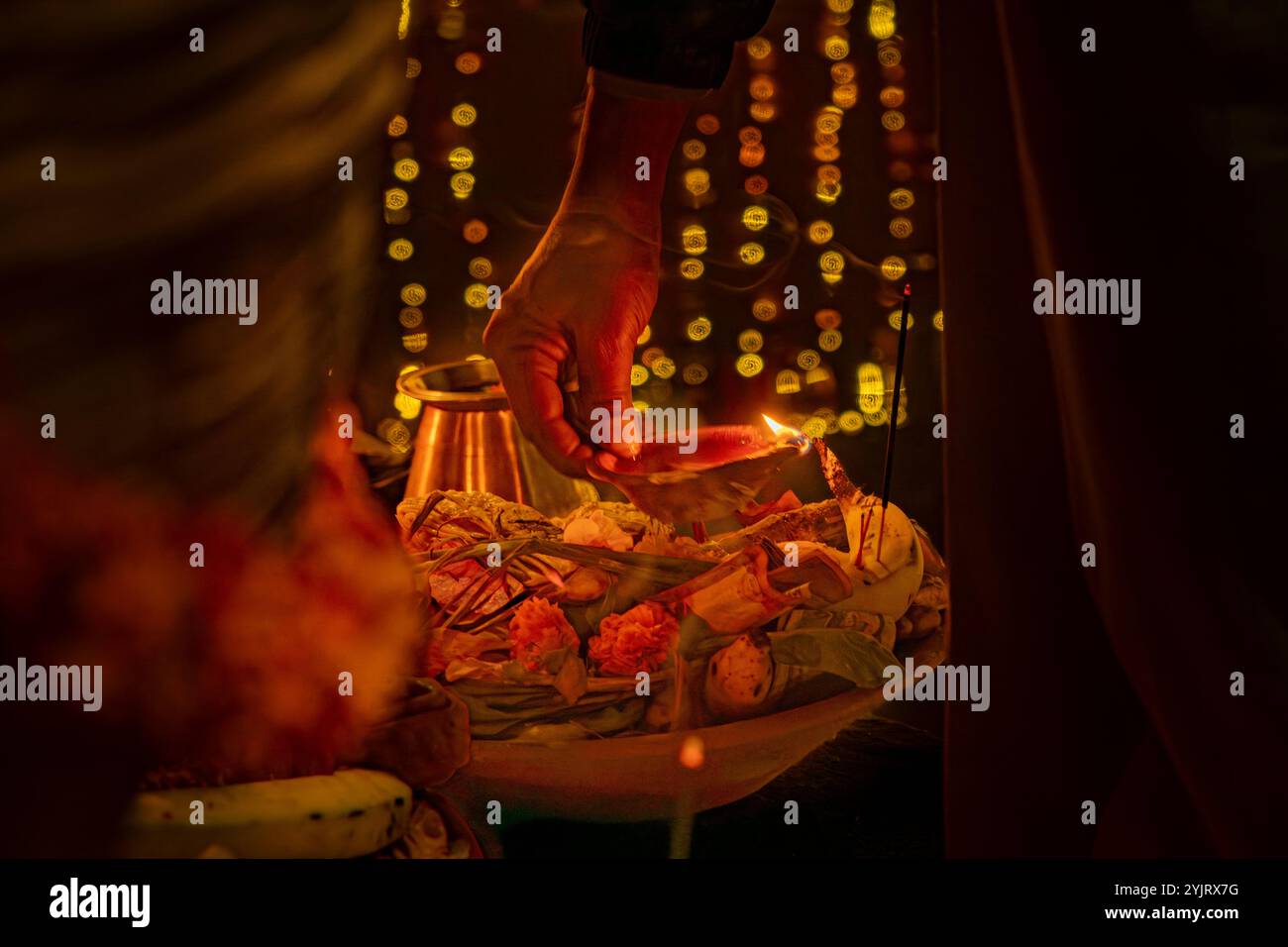 Kathmandu, Nepal - November 07, 2024 : Chhath Puja Parwa Sun God Celebration with Fruits, Lights and Lamps in river side pond in Nepal and India with Stock Photo