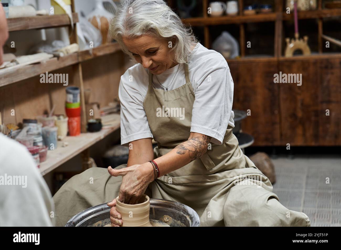 Mature beautiful woman sitting hi-res stock photography and images - Alamy