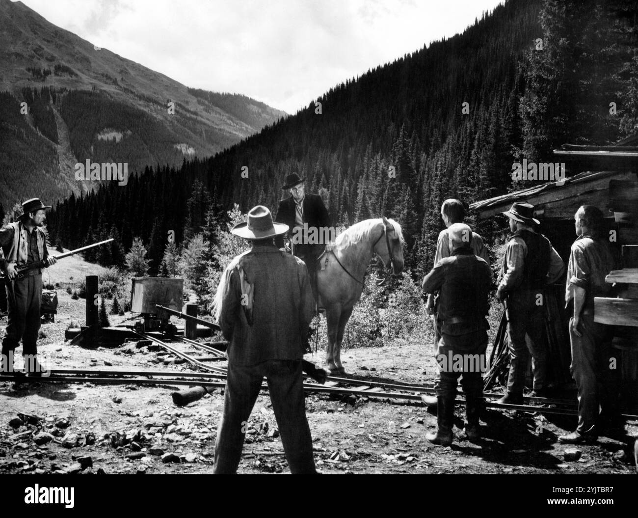 Robert Stack (on horse), on-set of the western film, 'Great Day In The Morning', RKO Radio Pictures, 1956 Stock Photo