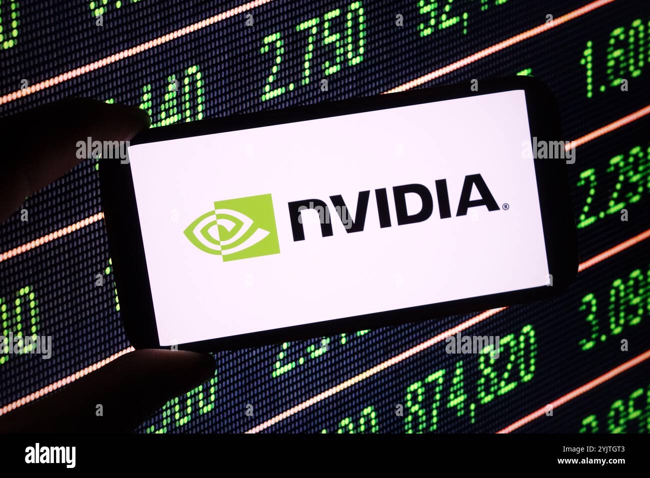In this photo illustration, the NVIDIA company logo is seen displayed ...
