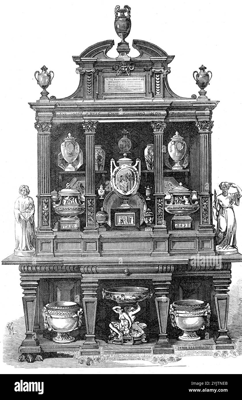 Cabinet and porcelain given to the Right Hon. John Bright, M.P., 1872. '...presentation of a testimonial from the Staffordshire Potteries' district to the Right Hon. John Bright, M.P...Messrs. Minton and Co., Messrs. Josiah Wedgwood and Sons, and Messrs. Copeland and Sons [were commissioned] to produce a collection of ceramics which should worthily represent the art-industry of the district...The collection is inclosed in a beautiful carved cabinet, designed by Mr. F. W. Moody, and executed by Mr. Brangan. Messrs. Minton have supplied the principal object...an original ovoid vase, treated in t Stock Photo
