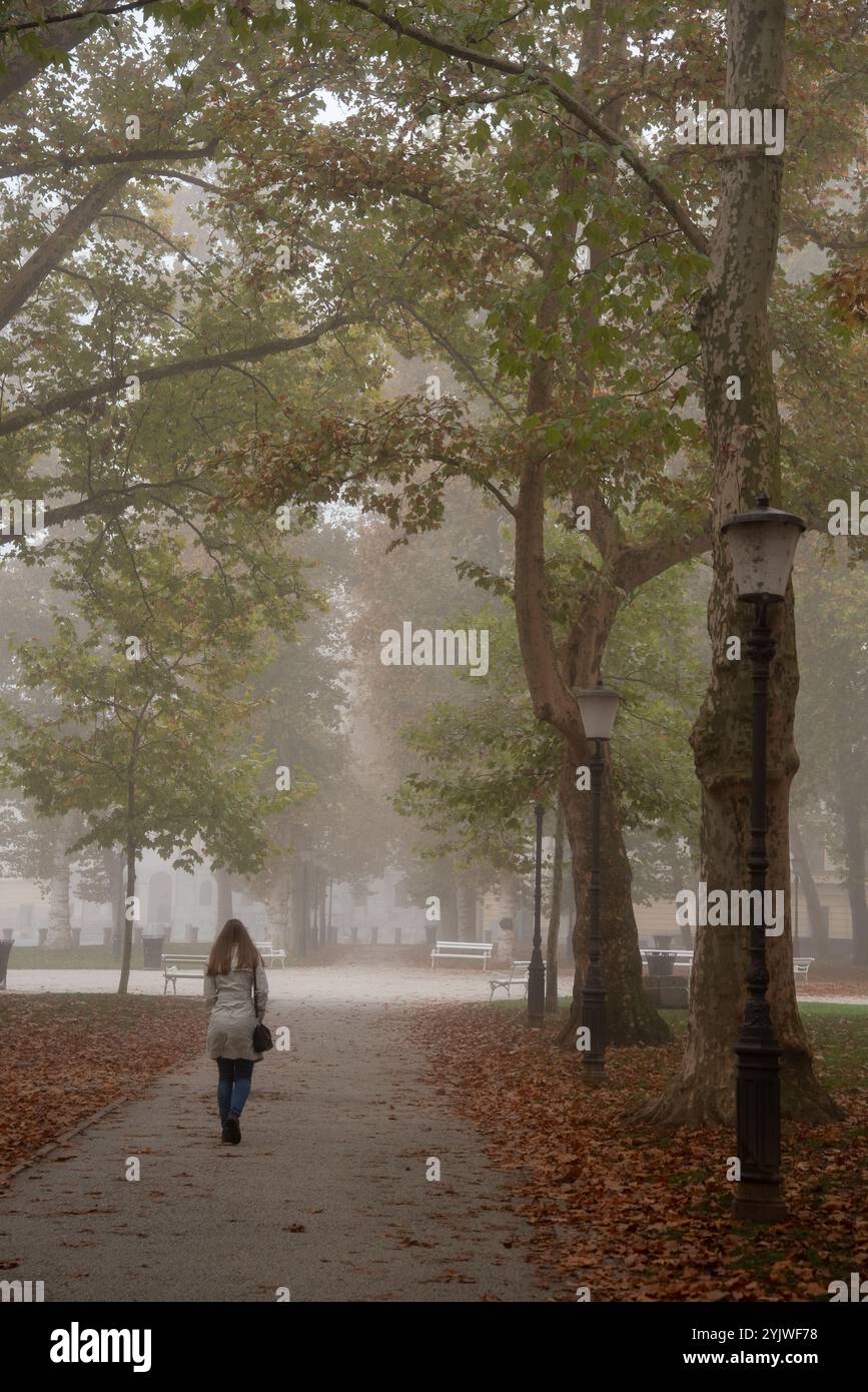 Adult walking alone park hi-res stock photography and images - Alamy