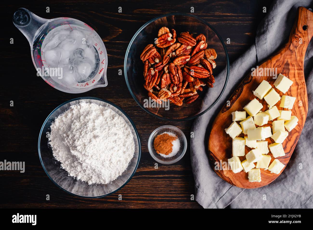 Prepped Ingredients for Pecan Shortbread Cookie Pie Crust: Measured and chopped ingredients for sweet pastry crust made with ground pecans Stock Photo