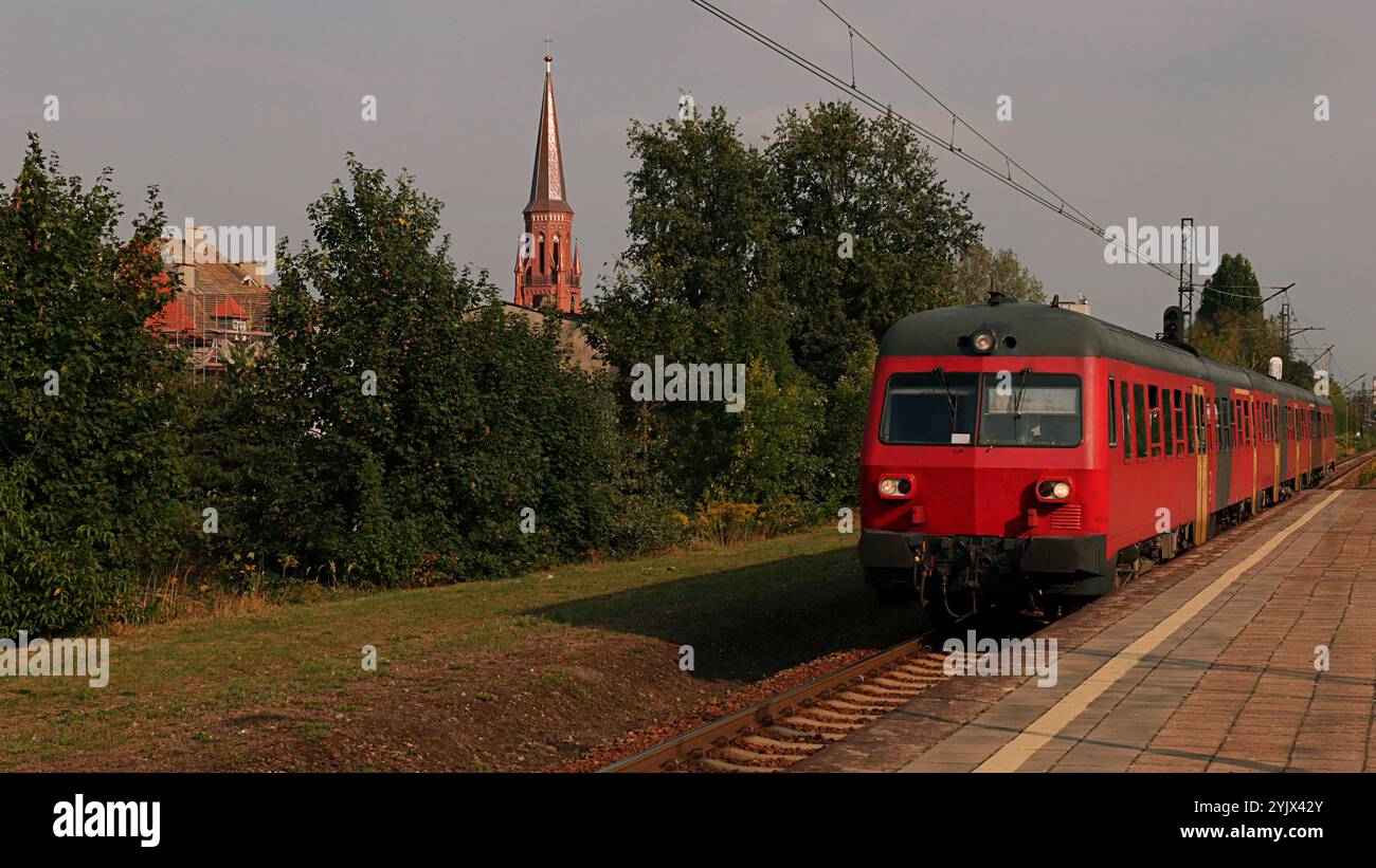 Red train at the station Poland. Stock Photo