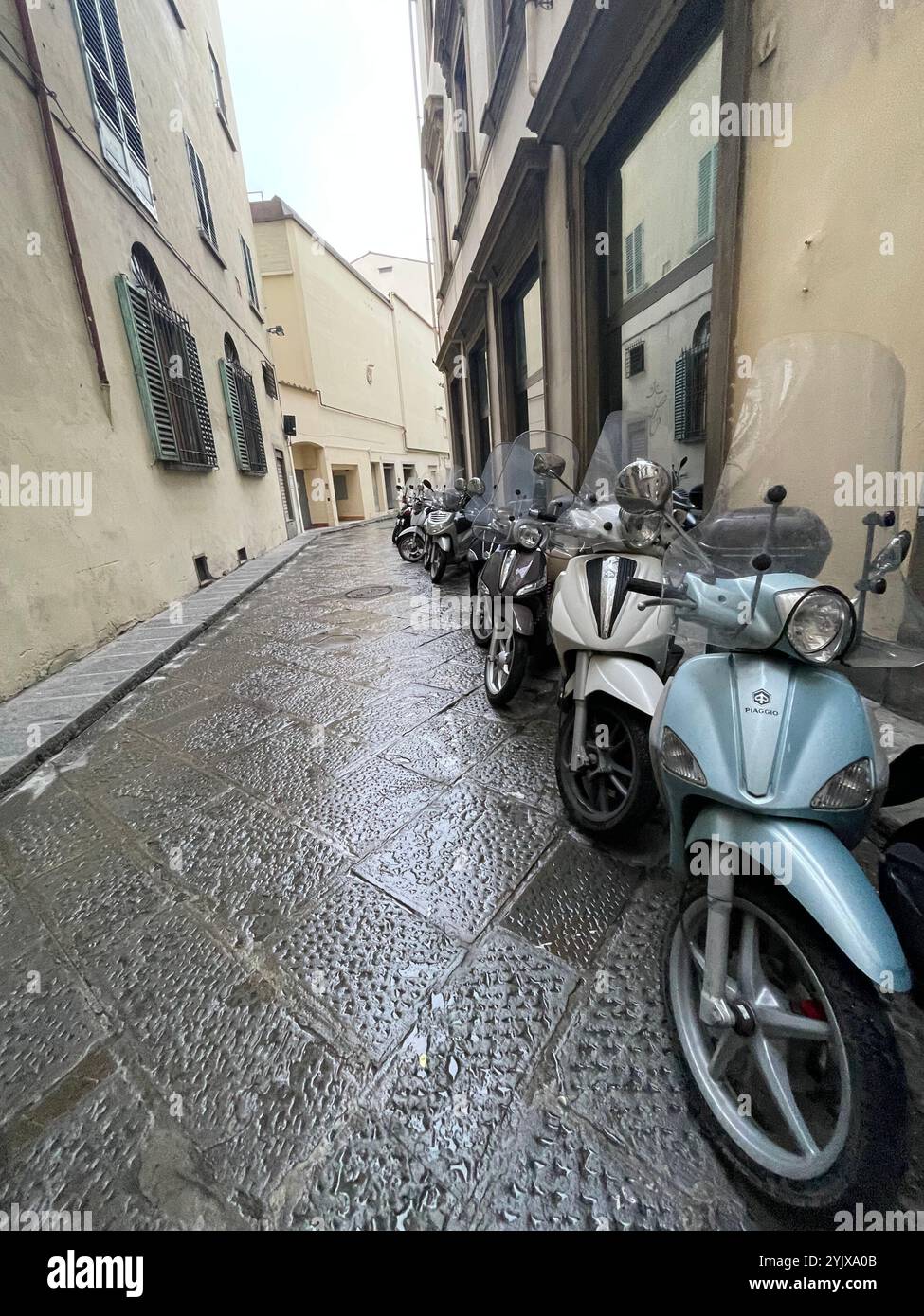 mopeds parked in florence - Smartphone Captured Stock Image