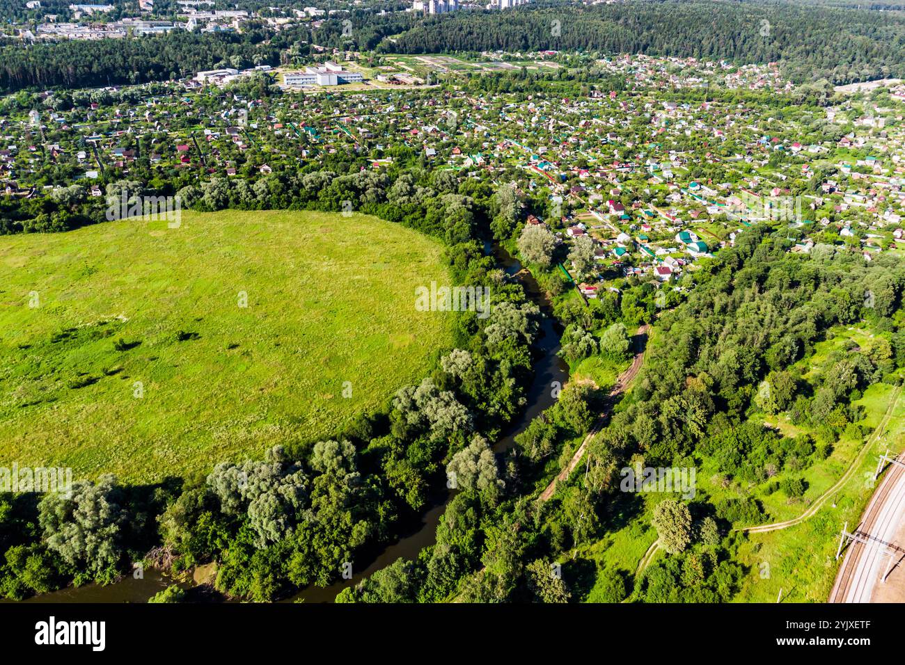 Aerial view of rural development on one side of the river Stock Photo ...