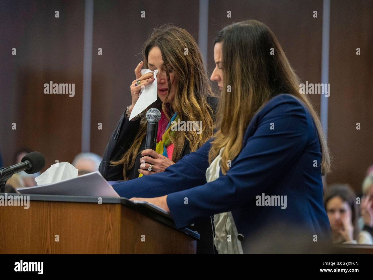 Jeanne Pepper, left, mother of Blaze Bernstein, wipes away tears as she ...