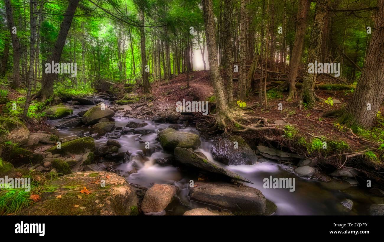 river flowing down the cliff with post glow effect and long exposure photography for wide angle desktop wallpaper. desktop wallpaper, 16:9 horizontal. Stock Photo