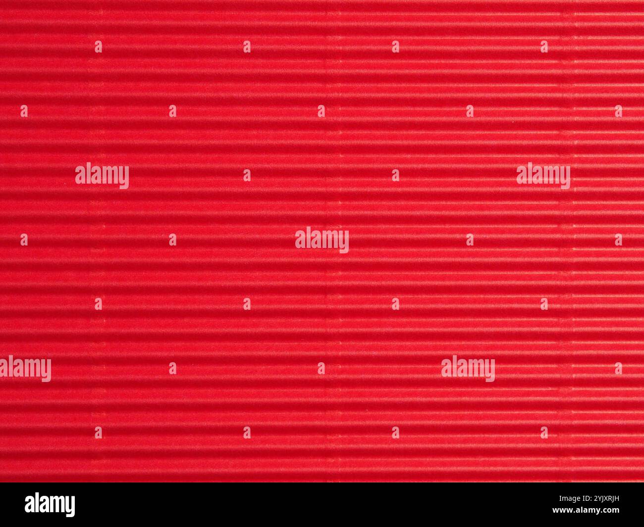 Red cardboard or paper texture using as holiday background or header Stock Photo