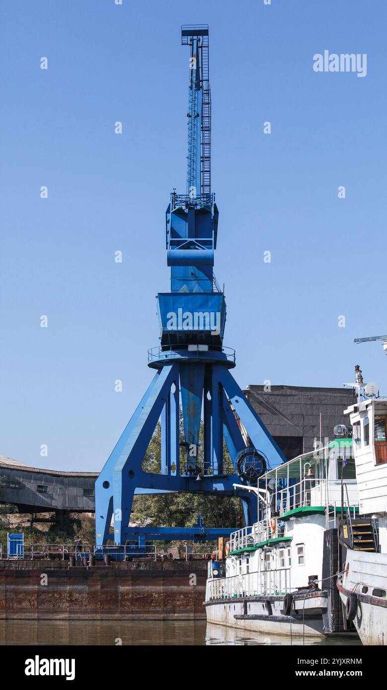 Blue portal crane, rear view, close-up vertical photo. Ruse, Bulgaria ...