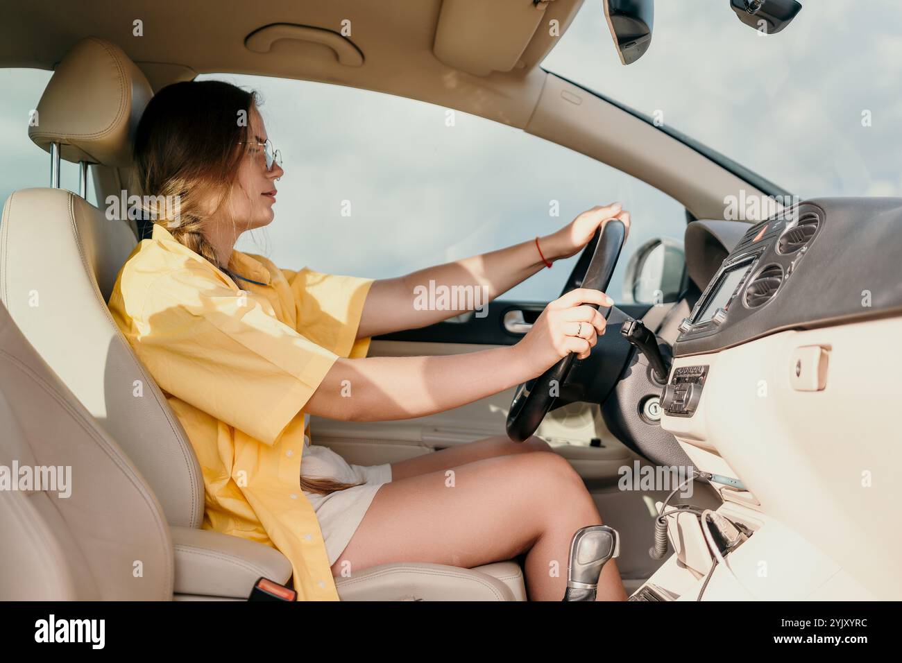Woman in driving car legs hi-res stock photography and images - Alamy
