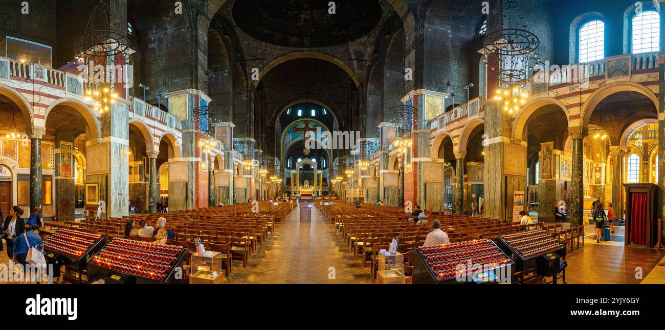 great panorama of the interior of westminster cathedral with some believers inside, london.UK. Stock Photo