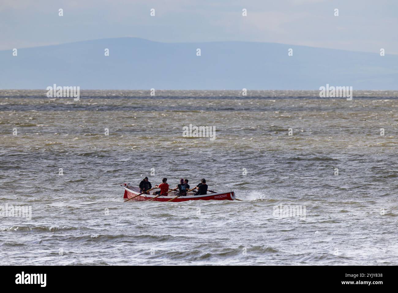 Pilot gig racing off Clevedon beach Stock Photo - Alamy