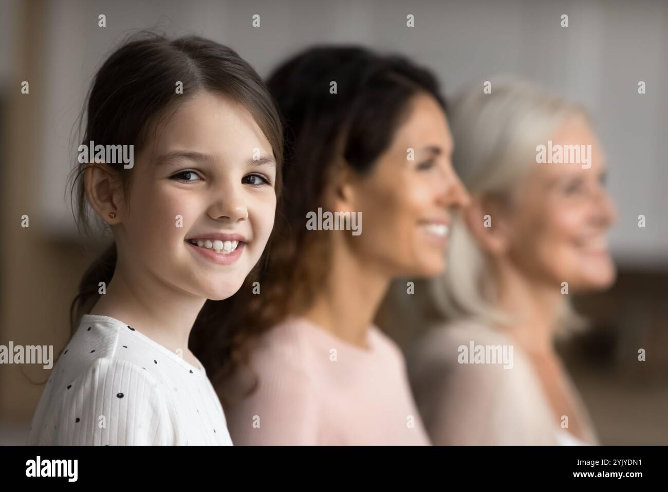 Little girl posing with mom and grandma, close up Stock Photo - Alamy
