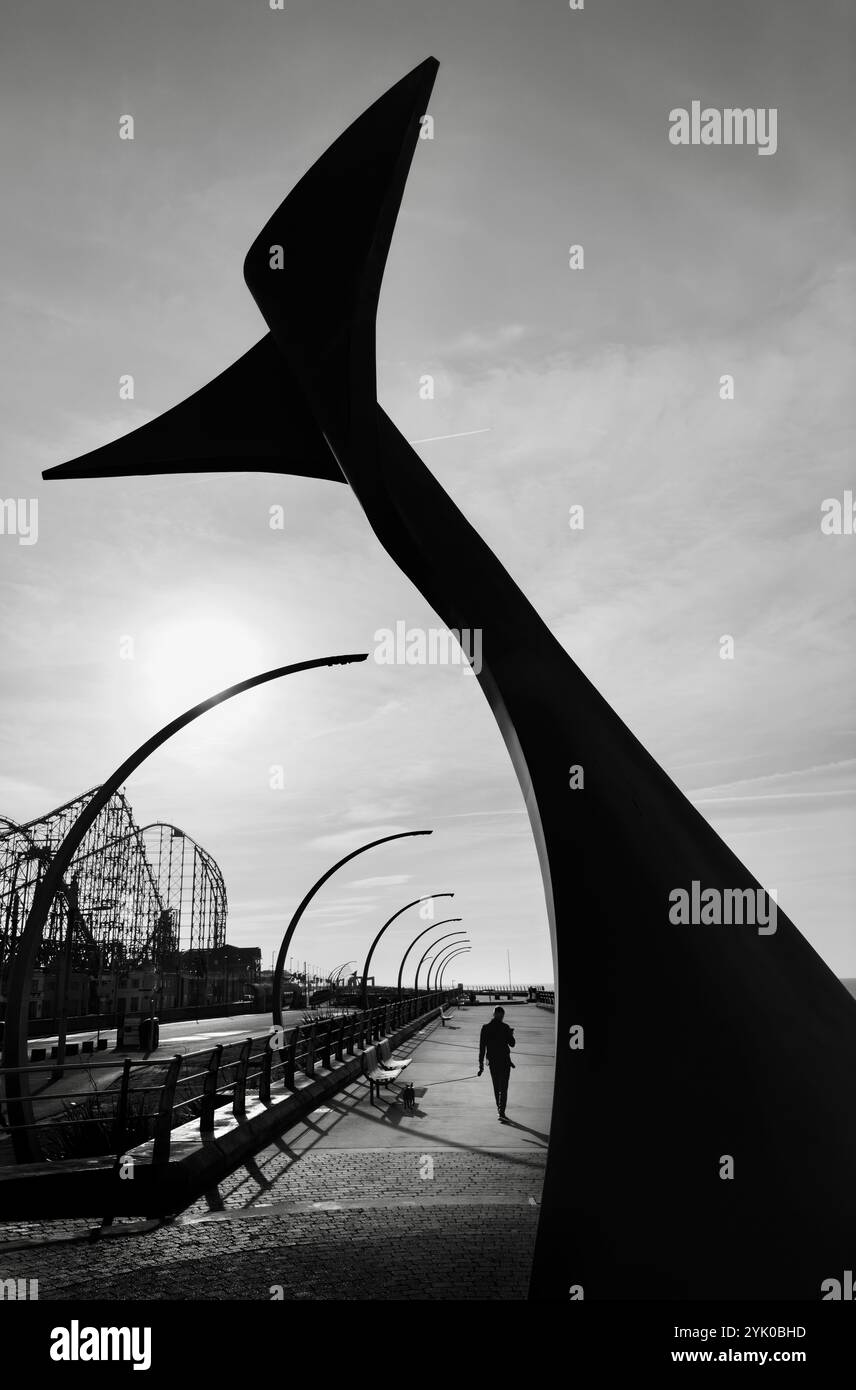 Whale Tail sculpture (wind shelter) on Blackpool South promenade with curved modern lights and backlit by sun. Blackpool UK - Smartphone Captured Stock Image