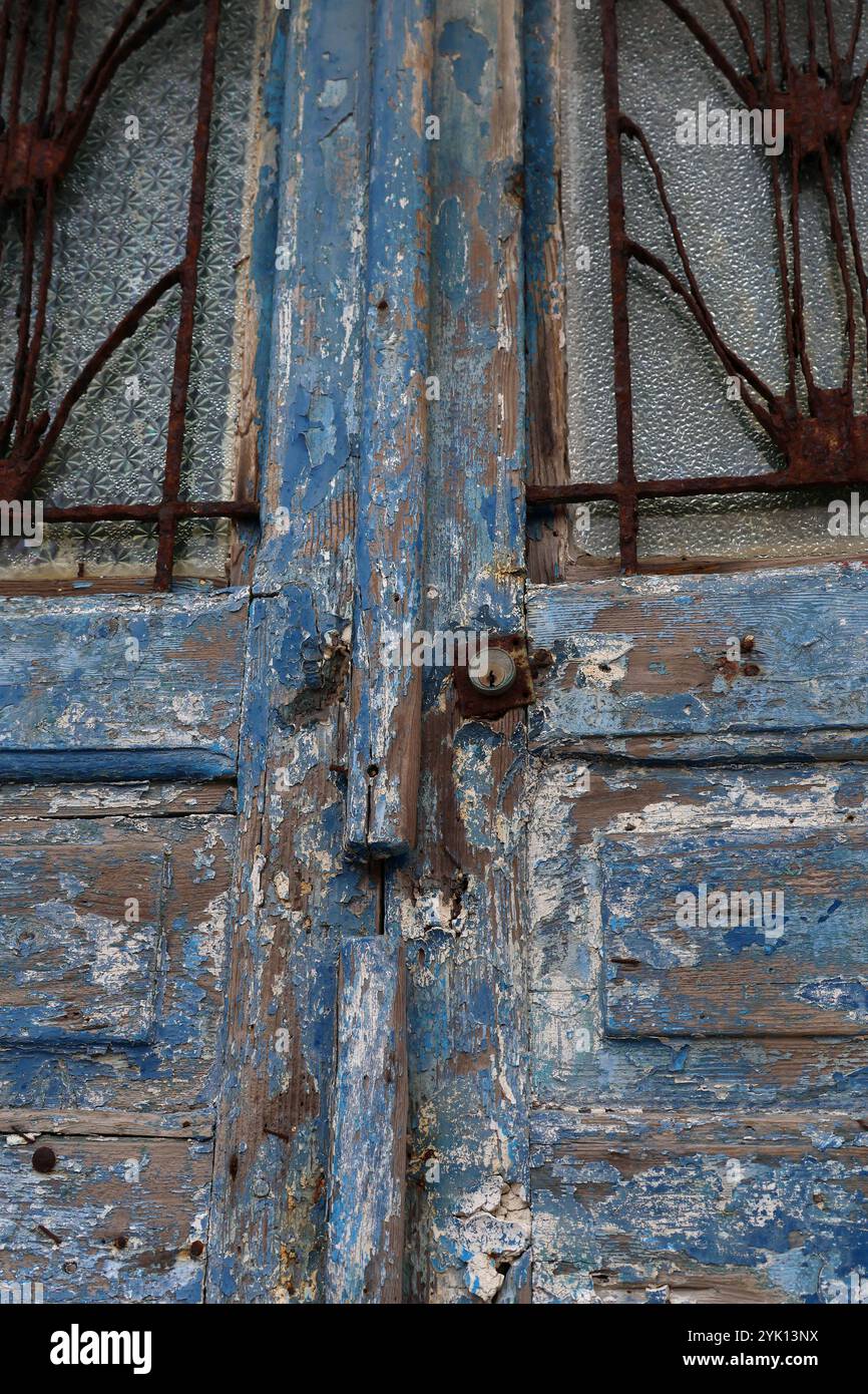 An old blue door with a rusty keyhole. Stock Photo