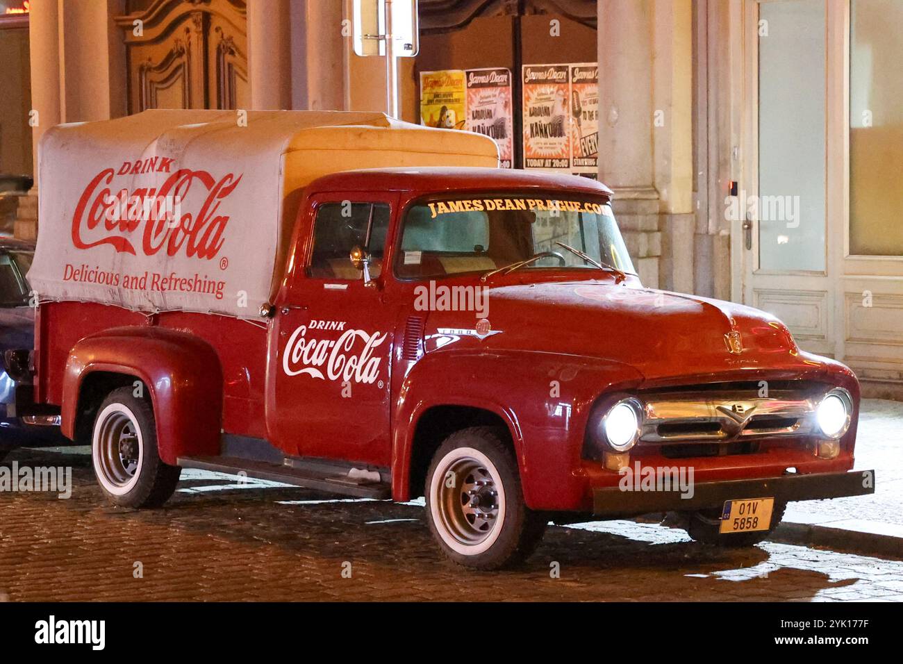 Red Ford truck Fordomatic, vintage American pickup with Coca Cola advertising sign on board. Stock Photo