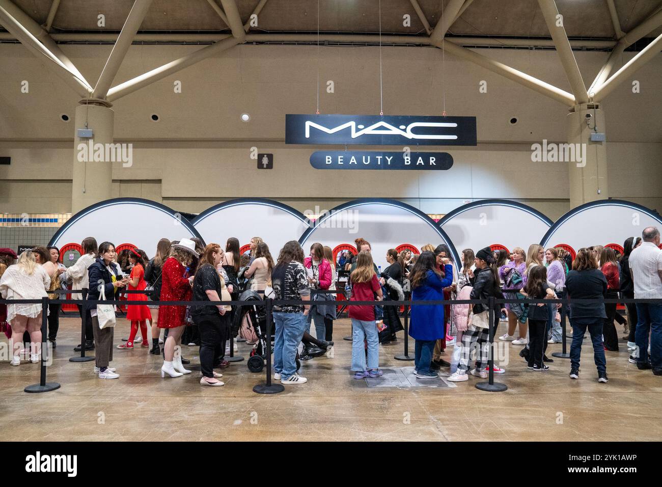 People line up for free make over at Mac beauty station Stock Photo - Alamy