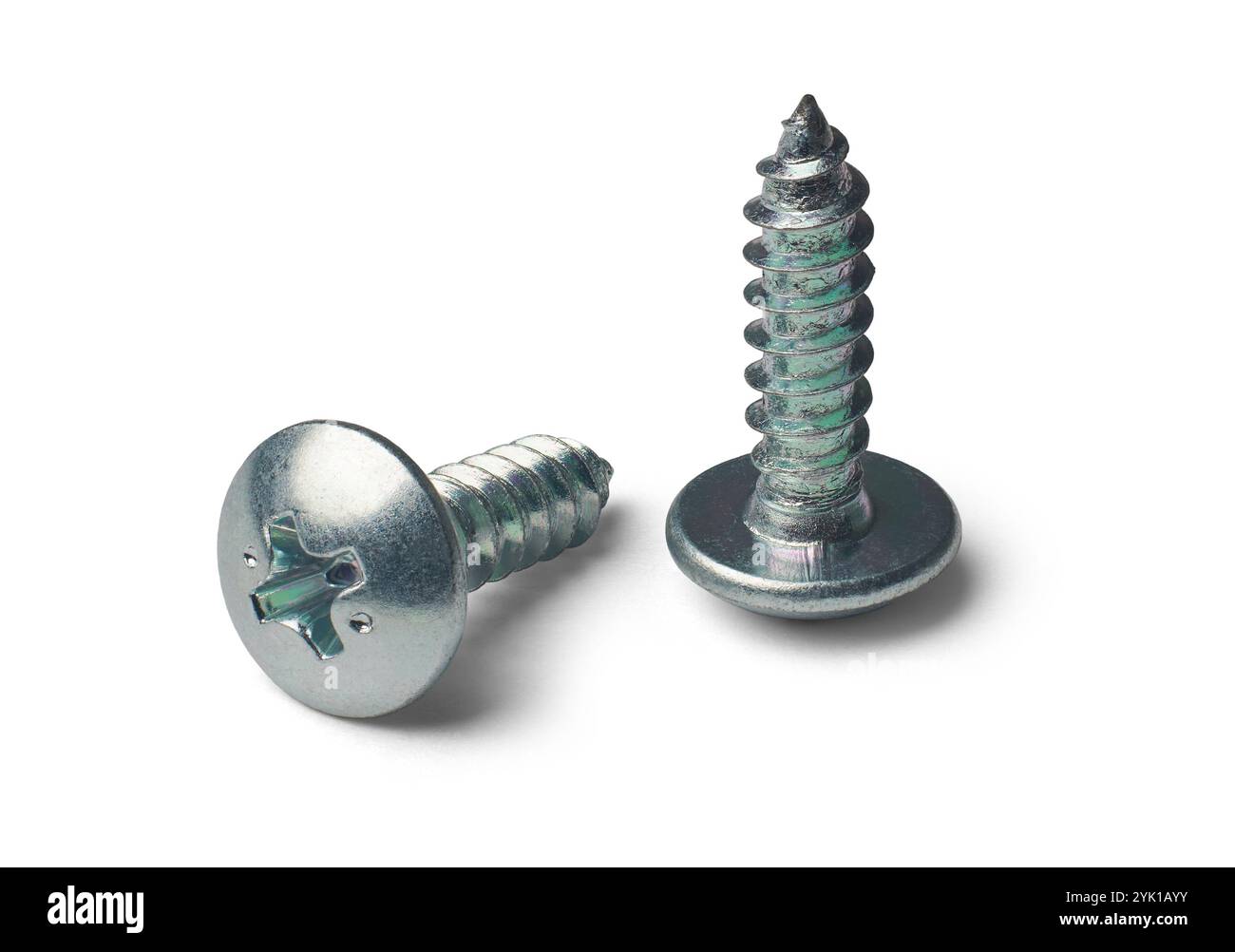 close-up of two self tapping phillips head screws with sharp point isolated white background, hardware used in construction, automotive or furniture Stock Photo
