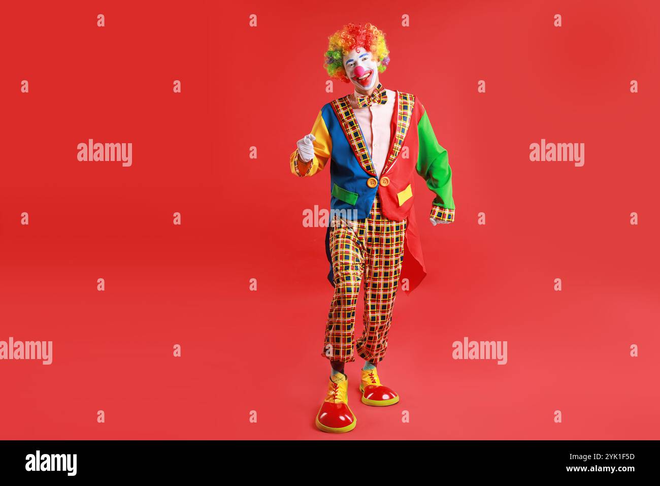 Happy male clown pointing hi-res stock photography and images - Alamy
