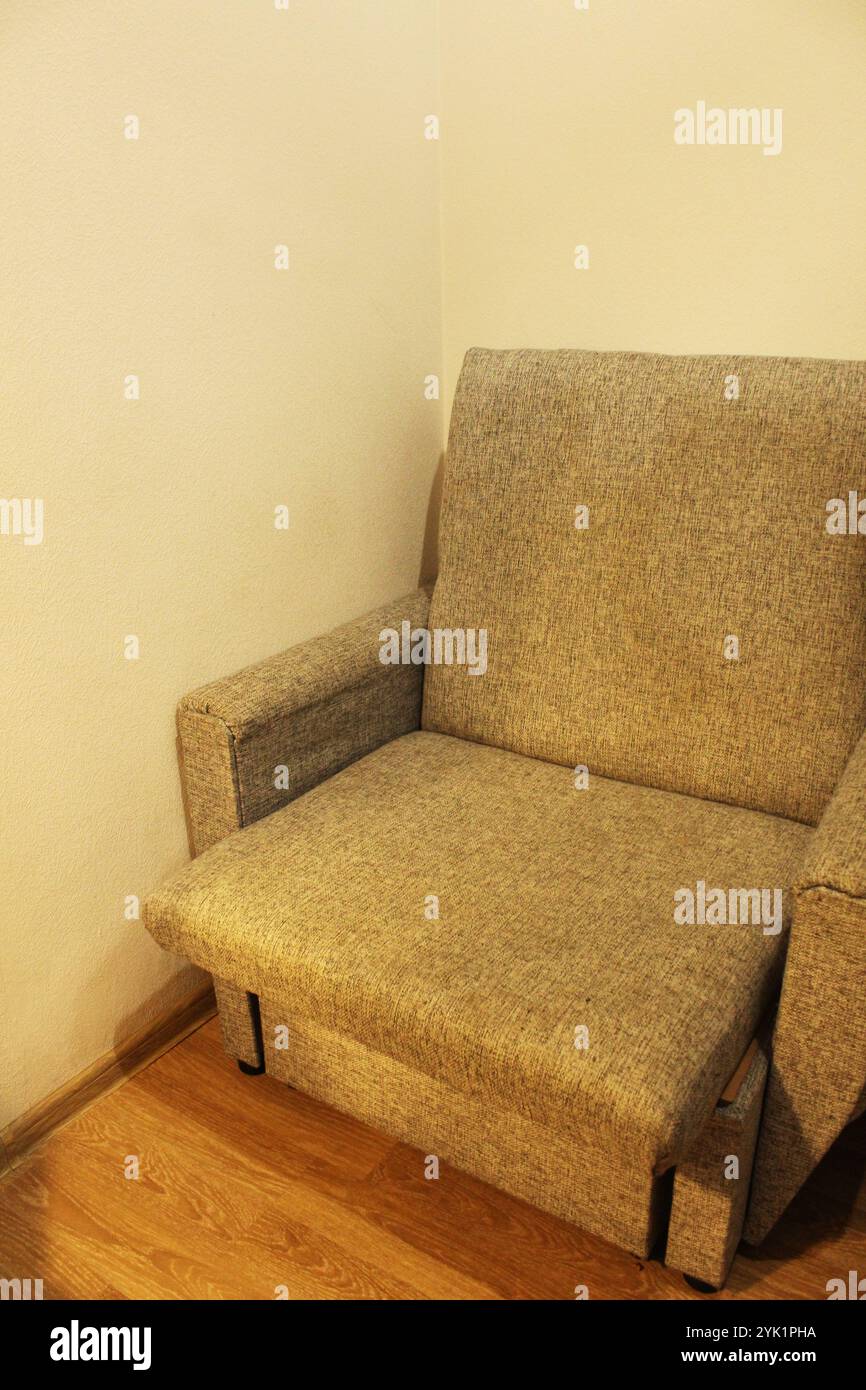An armchair in the corner of the room. Interior in the room Stock Photo ...