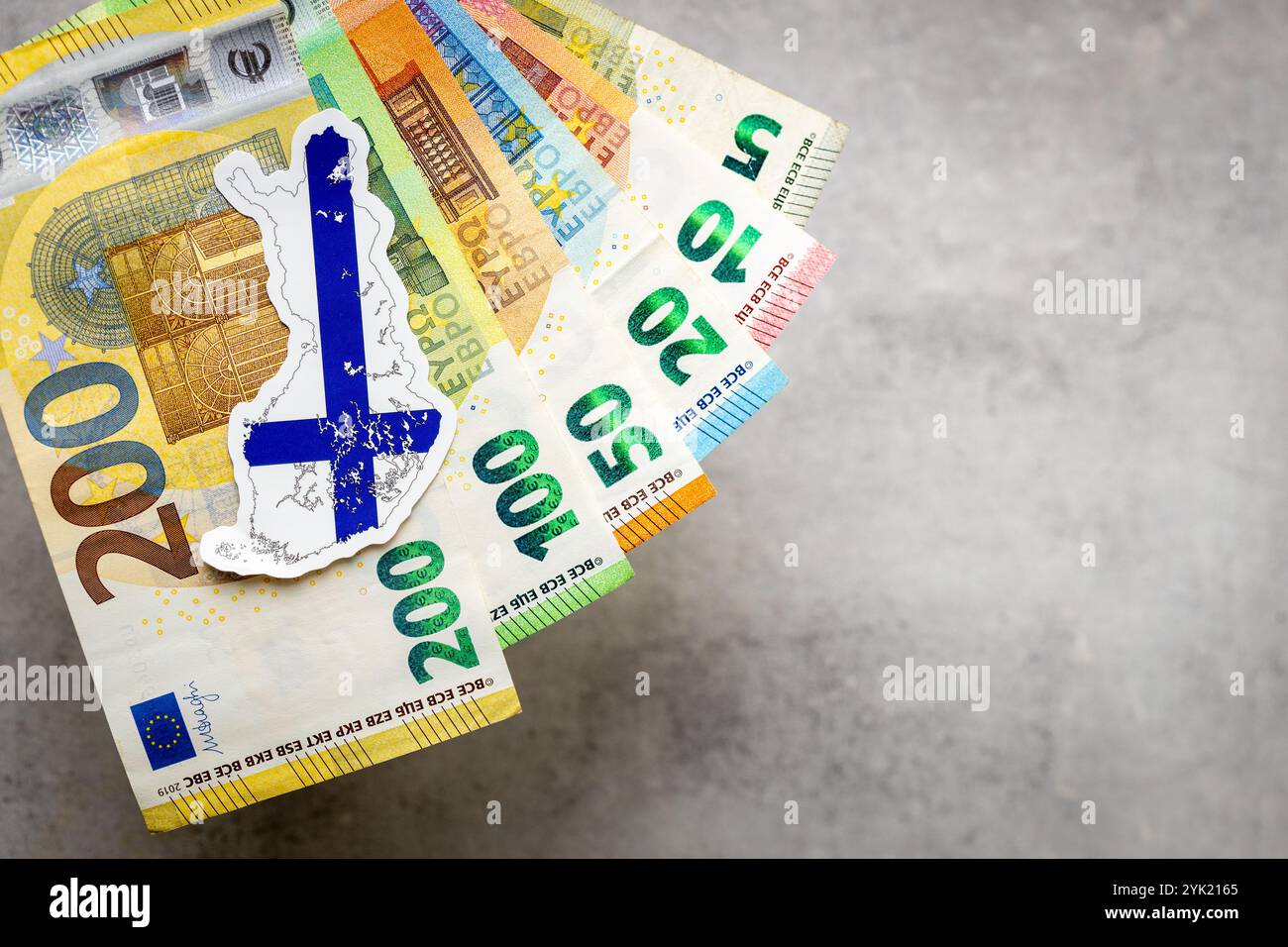 Finland money and national emblem, Gray background, copy space, flat lay, Financial background, close up Stock Photo