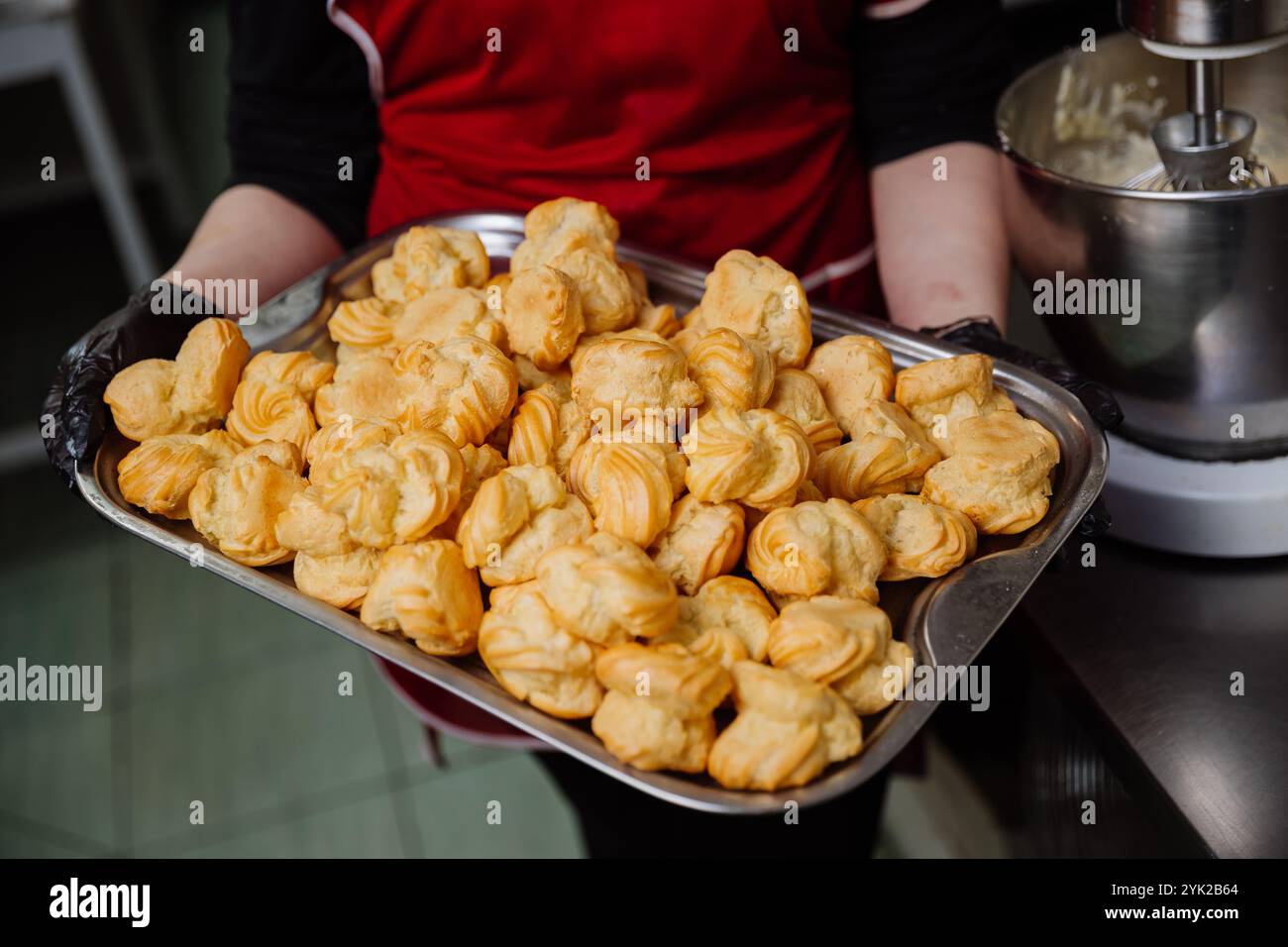 Choux Display Freshly baked choux pastries on a tray, perfect for desserts or bakery ...
