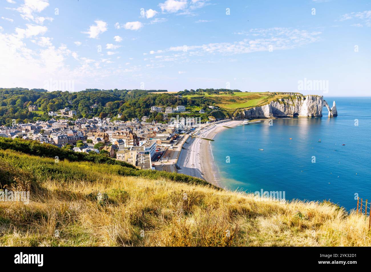 Etretat and chalk cliffs with rock gate La Porte d'Aval and rock needle ...