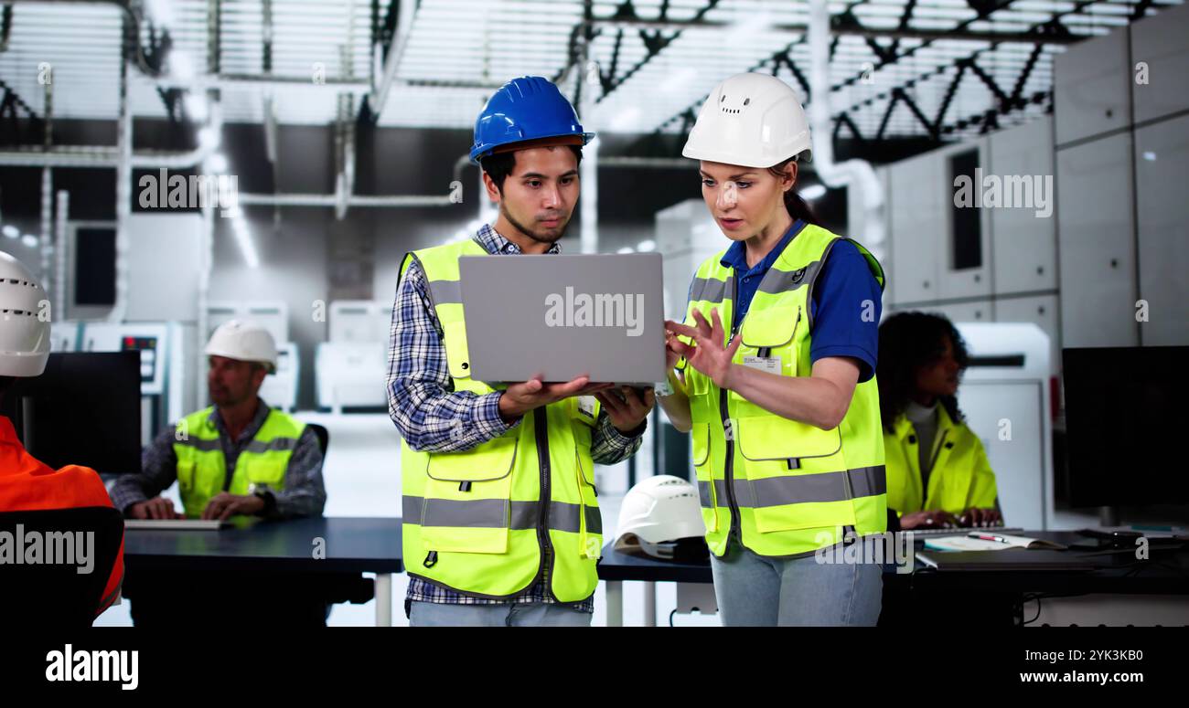 Factory Worker Osha Inspection Using Laptop Computer Stock Photo