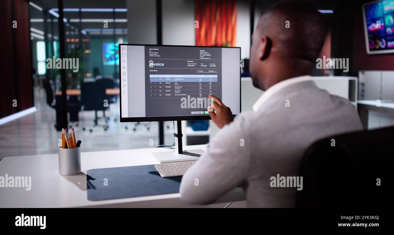 E Invoice Business Management. Accountant Using Electronic Invoice Stock Photo