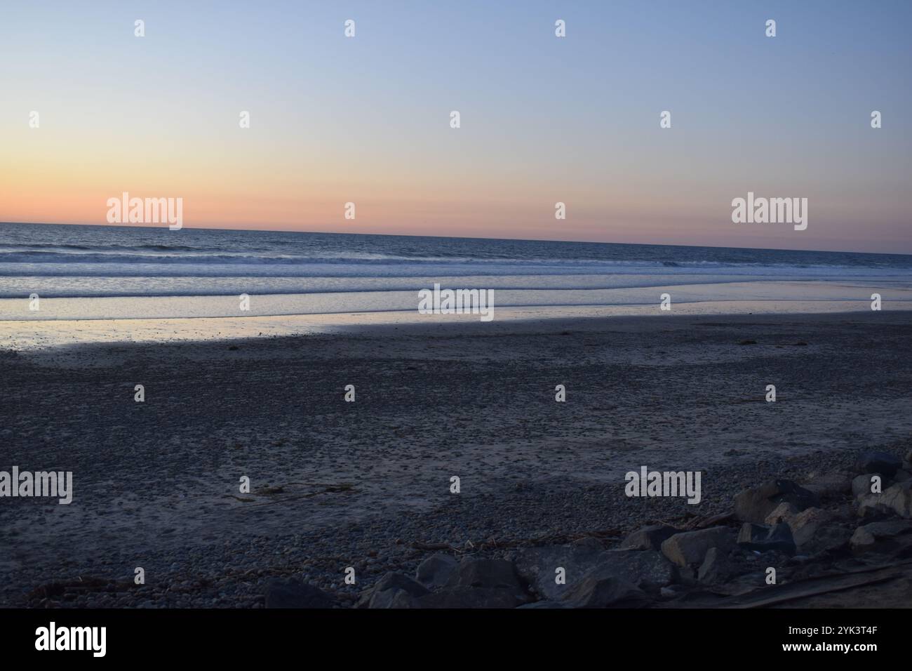 Surfing and paddling during high tide at Torrey Pines State Beach