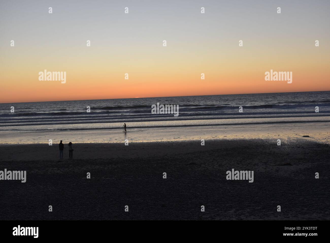 Surfing and paddling during high tide at Torrey Pines State Beach
