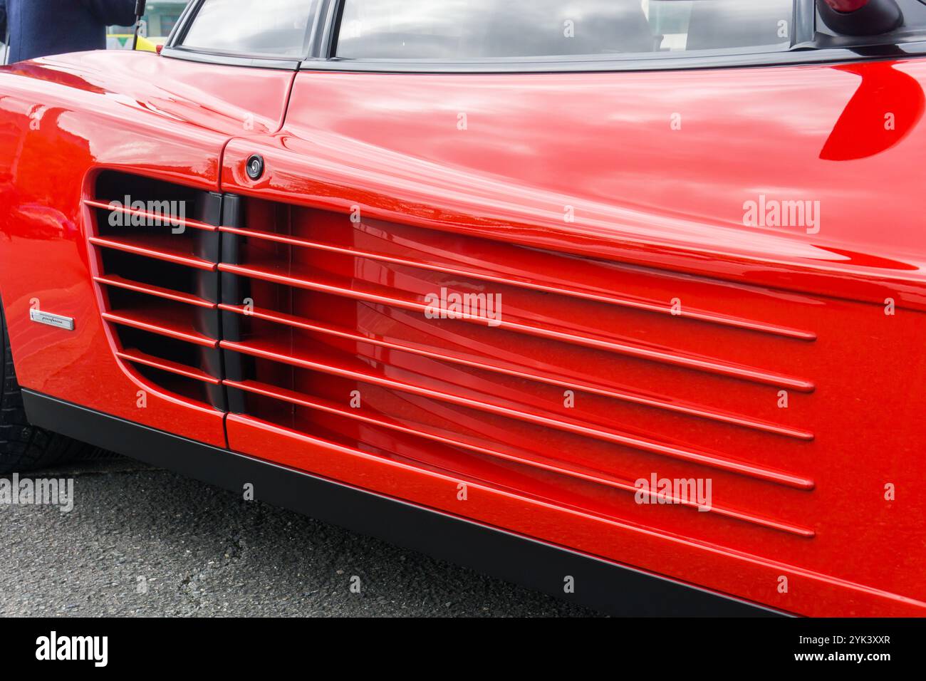 Close up detail of the side strake air intakes on a rosso corsa red Ferrari Testarossa classic 1980s Italian sports car Stock Photo