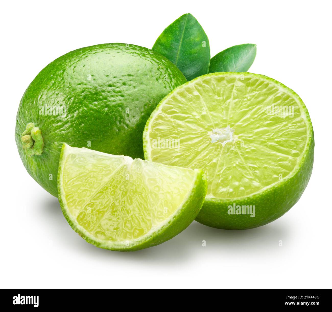 Ripe lime fruits with slices and lime leaves isolated on a white background. File contains clipping path. Stock Photo