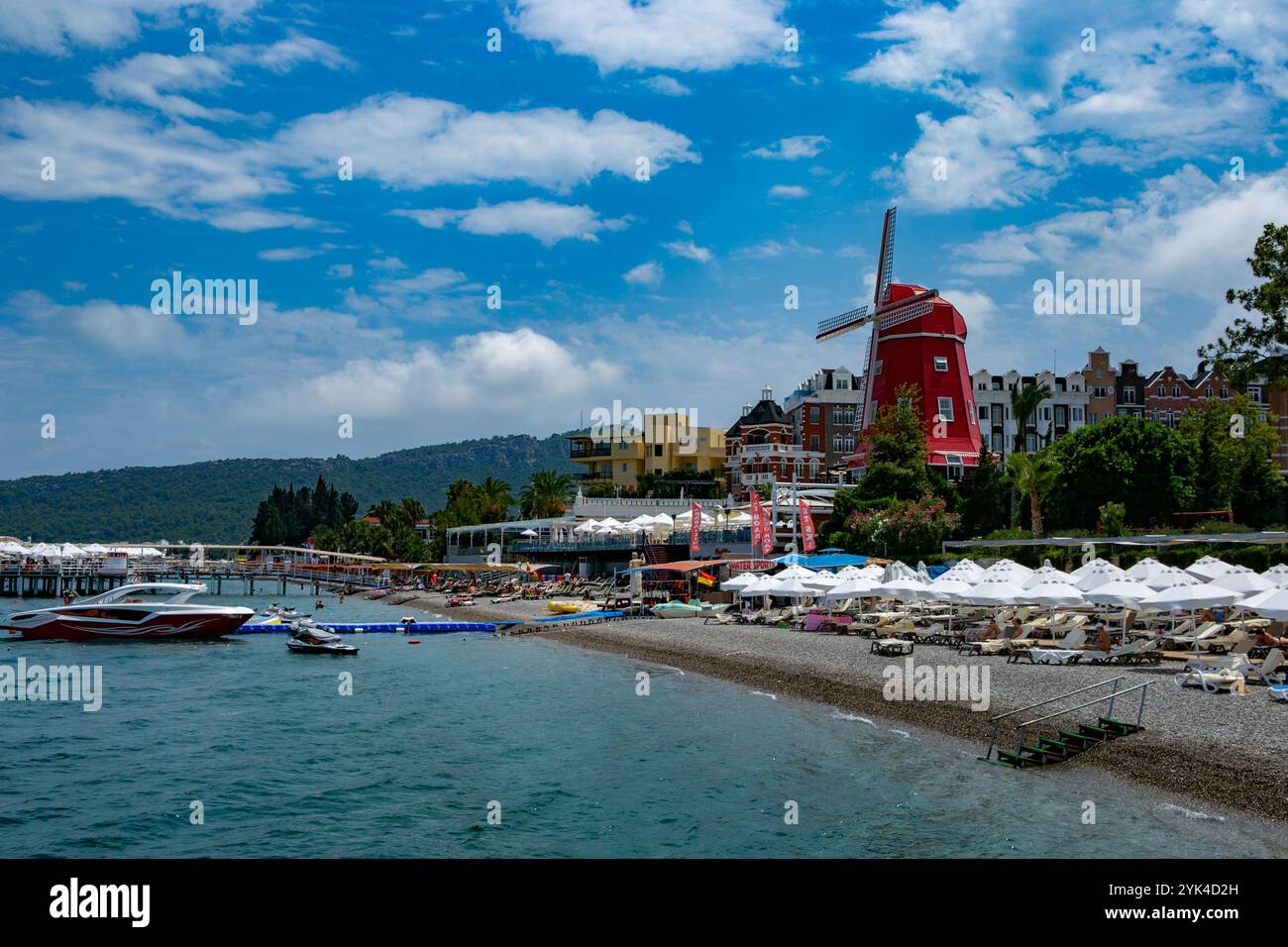 Tourists enjoy the beaches of the Turkish resort of Antalya. Antalya is the largest Turkish city on the Mediterranean coast and Turkish Riviera, and is locates in the southwestern coast of the Turkish region of Anatolia. In addition to be a popular tourist destination, Antalya is a city full of history since its foundation around 150 BC Stock Photo