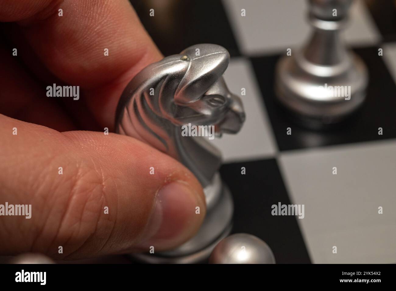 Hand moves queen piece on hi-res stock photography and images - Alamy