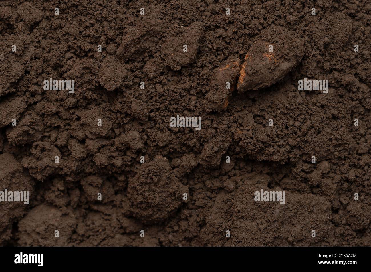 Ground compost brown color cut with stones close up view Stock Photo ...