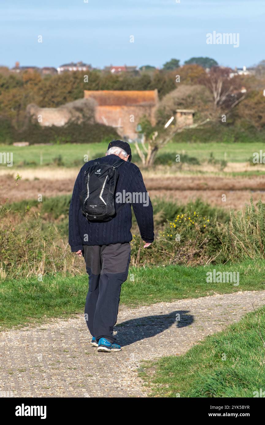 Older man walking along track hi-res stock photography and images - Alamy