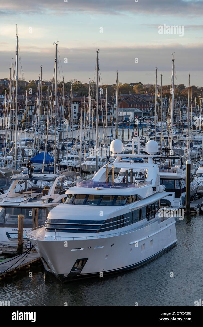 large luxury motorboat or motor yacht moored in the marina on a pontoon in Lymington, Hampshire, UK Stock Photo