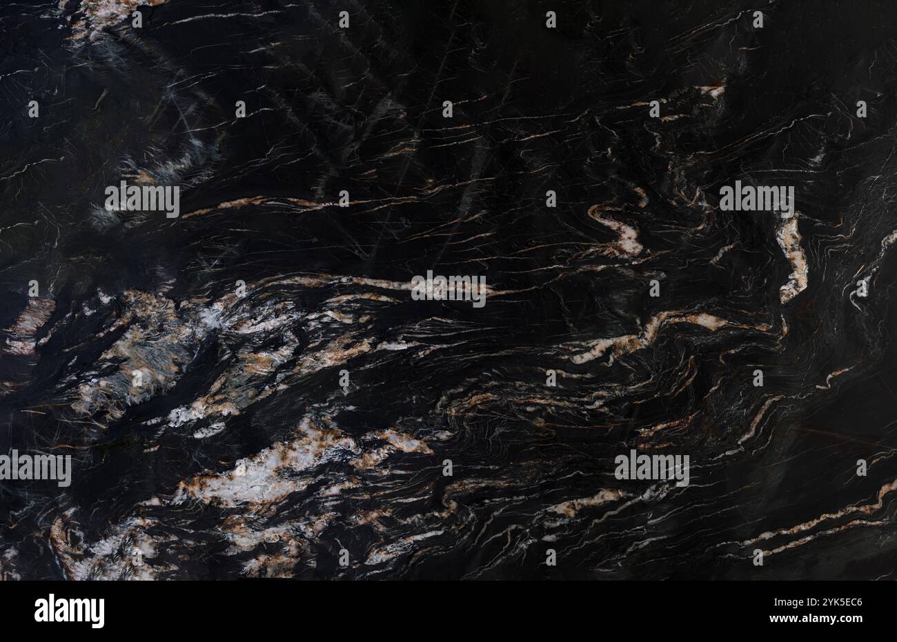 Luxurious black marble texture featuring intricate white and brown veining. Stock Photo