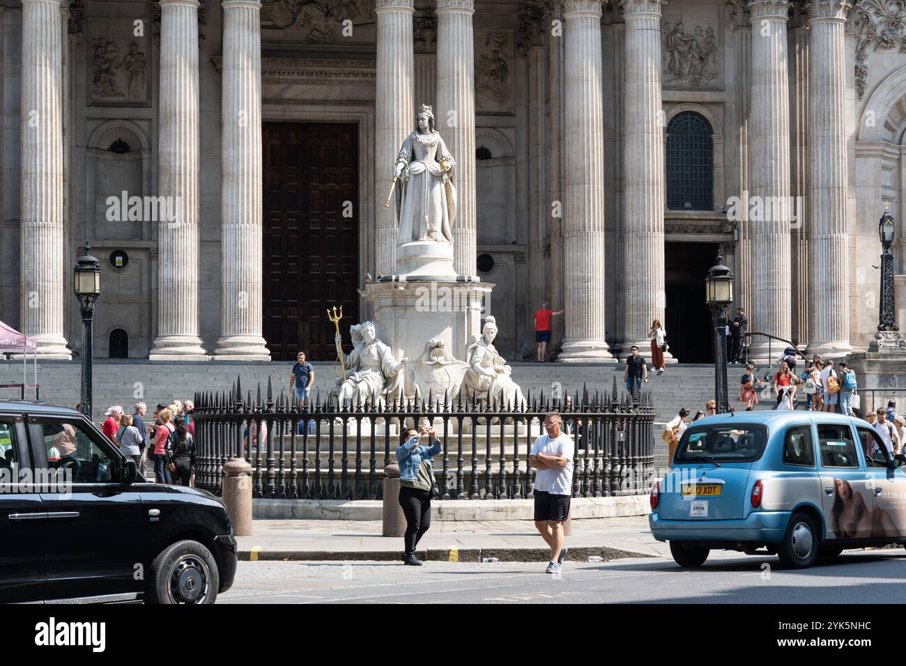A statue of Queen Anne is installed in the forecourt outside the west front of St Paul's Cathedral, London, UK. It is Grade II listed landmark Stock Photo