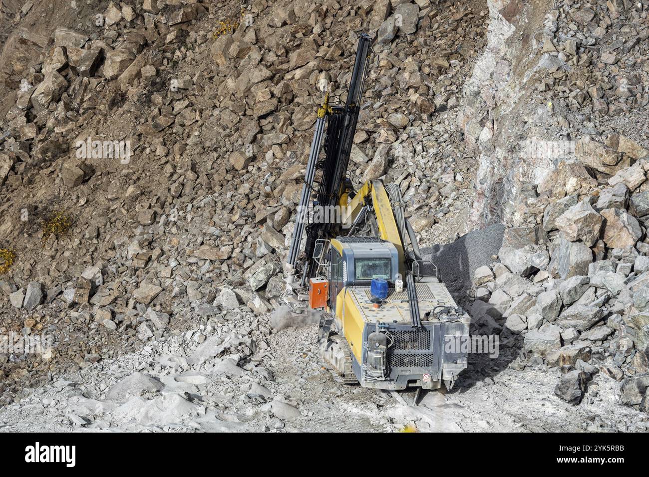 Drilling machine in open cast mining quarry Stock Photo