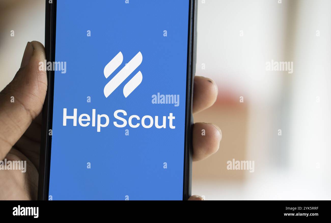 Help Scout logo is displayed on smartphone. Help Scout PBC is a global ...