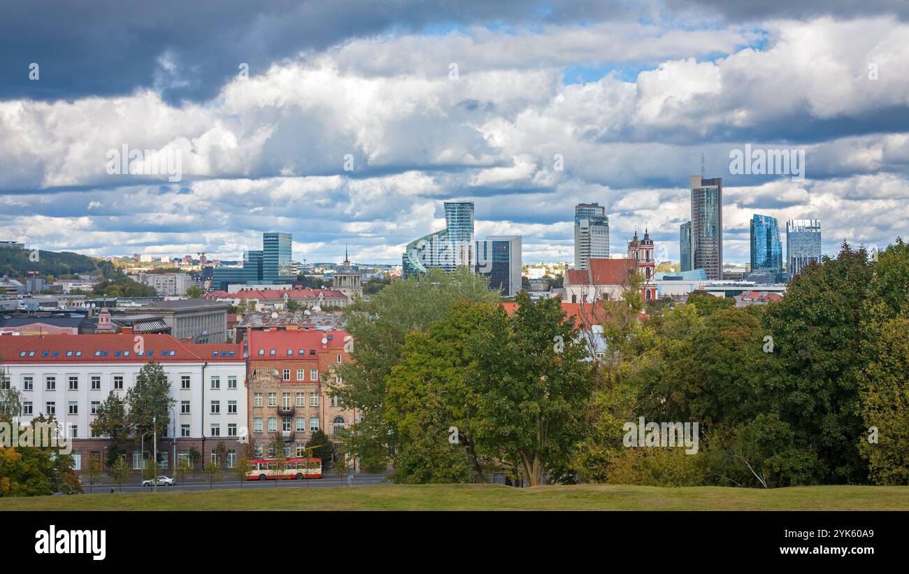 Lithuania, Vilnius - September 29, 2018 - Panoramic view of the city and a trolleybus passing in the distance. Modern and old buildings under a beauti Stock Photo