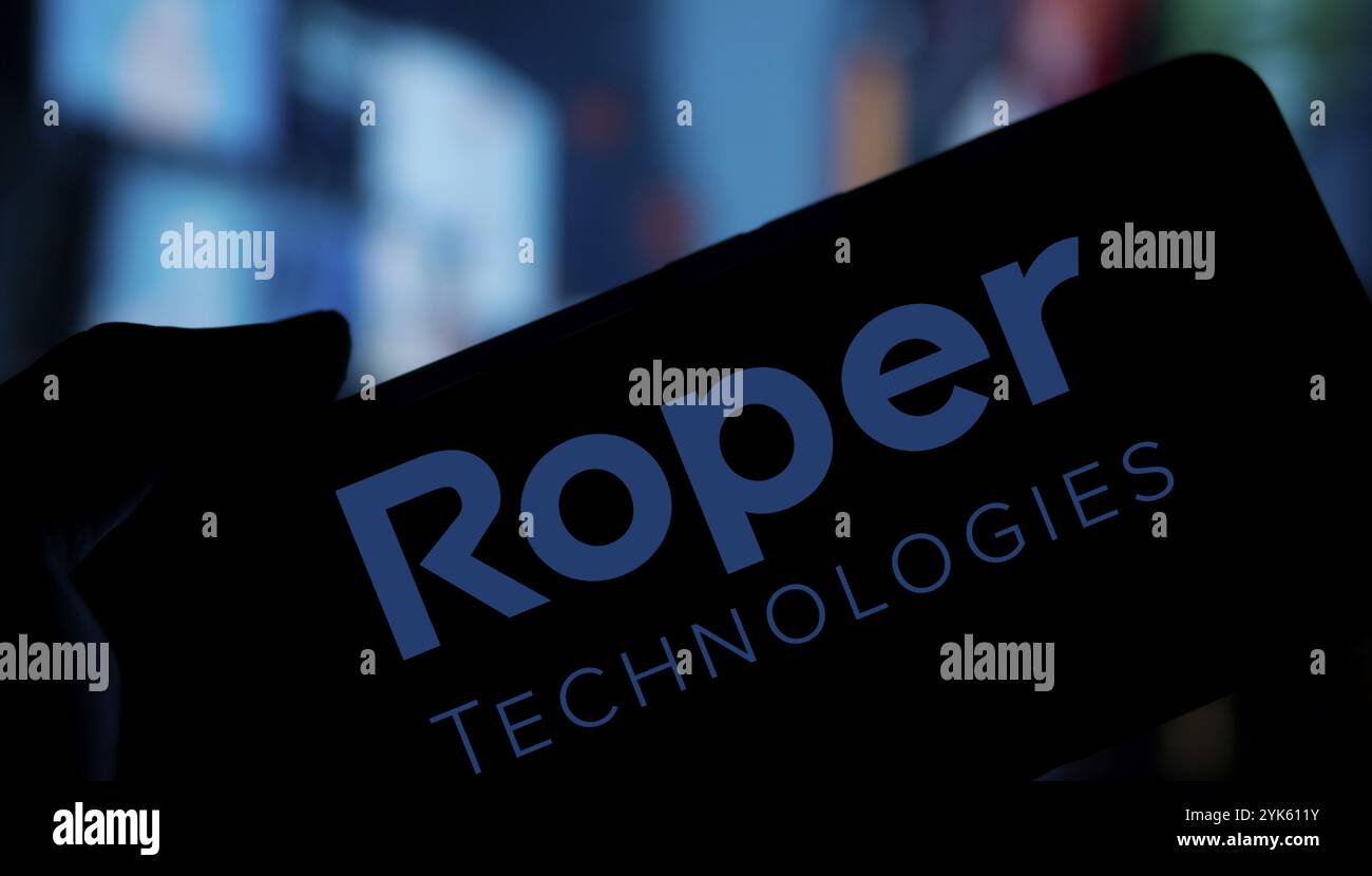 Roper Technologies logo is displayed on smartphone. Roper Technologies ...