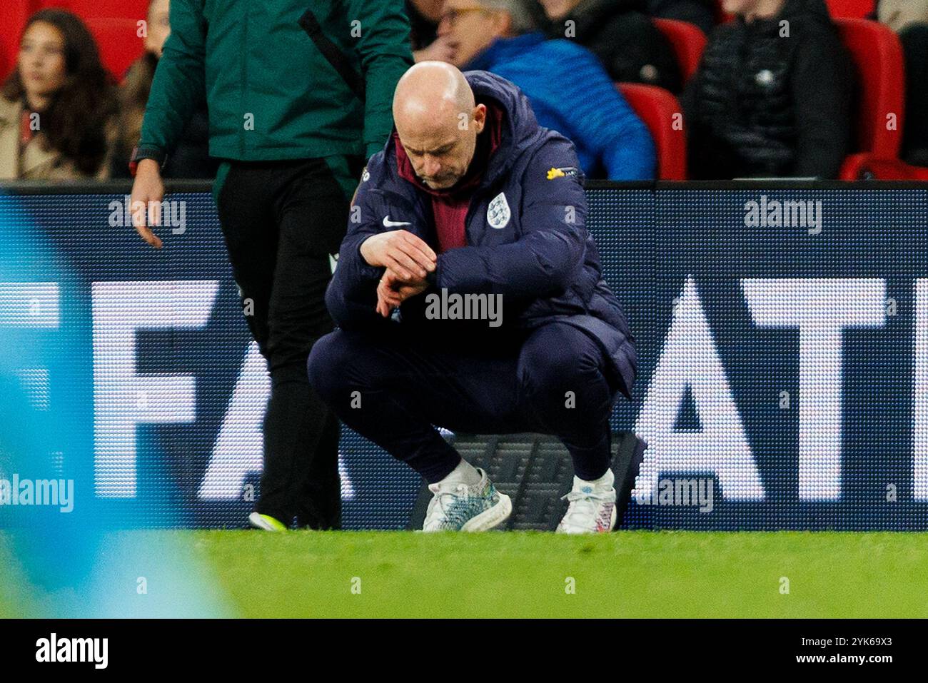 London, UK. 17th Nov, 2024. England Manager Lee Carsley checking the time remaining during the England v Republic of Ireland UEFA Nations League Round 1 Group F match at Wembley Stadium, London, England, United Kingdom on 17 November 2024 Credit: Every Second Media/Alamy Live News Stock Photo