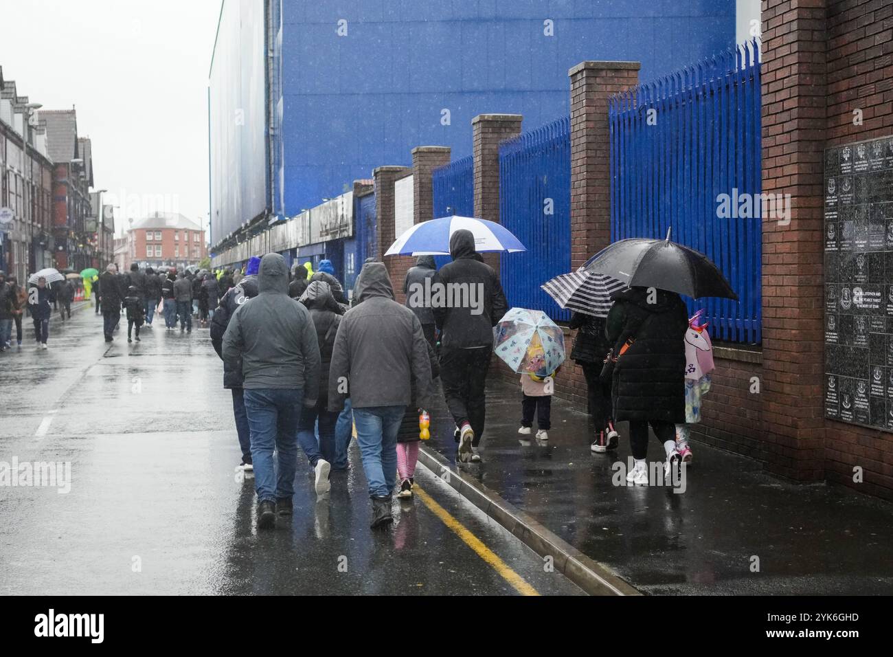 UK. 17th Nov, 2024. Everton FC v Liverpool FC Barclays Womens Super League GOODISON PARK ENGLAND - November 17th 2024 Fans arrive to the game in heavy rain at the Barclays Women´s Super League match between Everton FC and Liverpool FC at Goodison Park onNovember 17th 2024 in Liverpool, England. Credit: ALAN EDWARDS/Alamy Live News Stock Photo