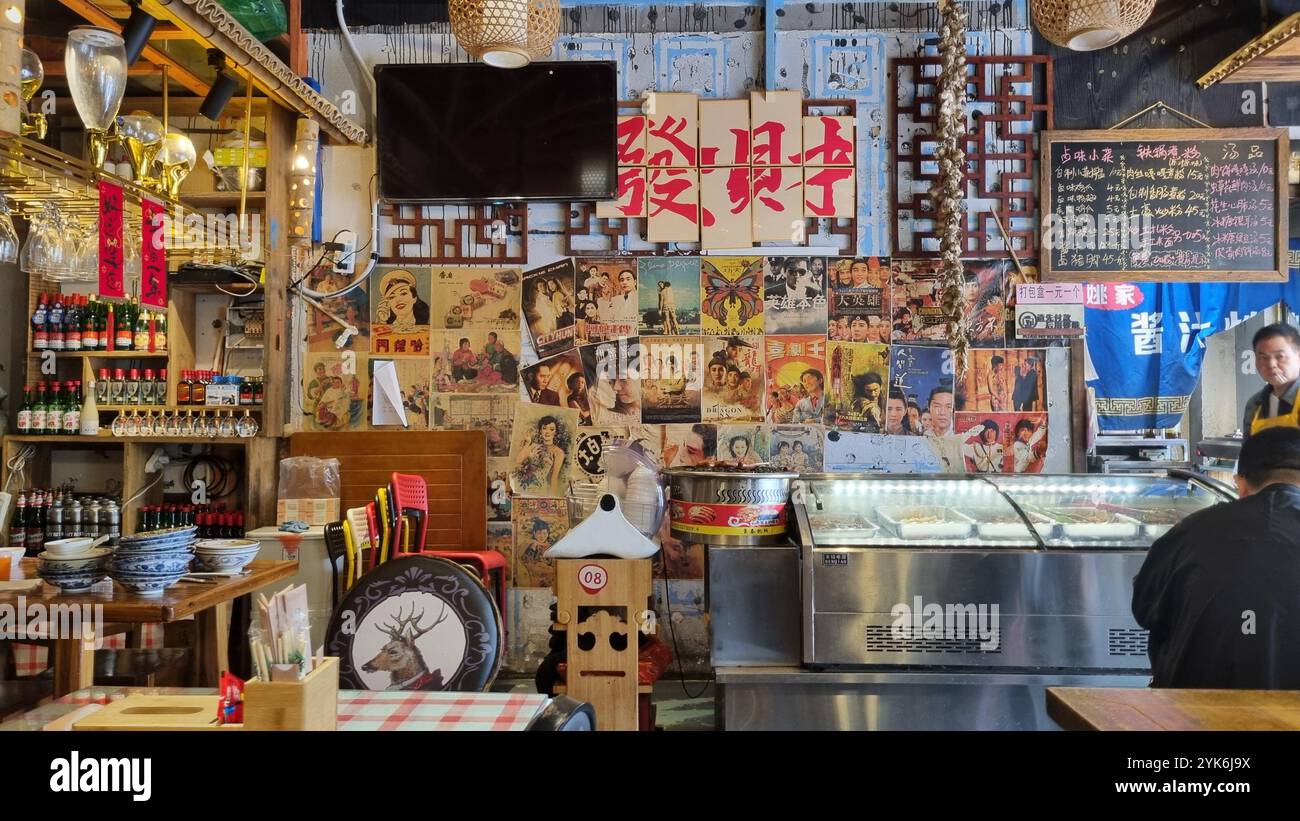 A glimpse into the past, this image showcases a collection of vintage Chinese propaganda posters and pamphlets. - Smartphone Captured Stock Image